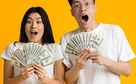 Asian couple with cash